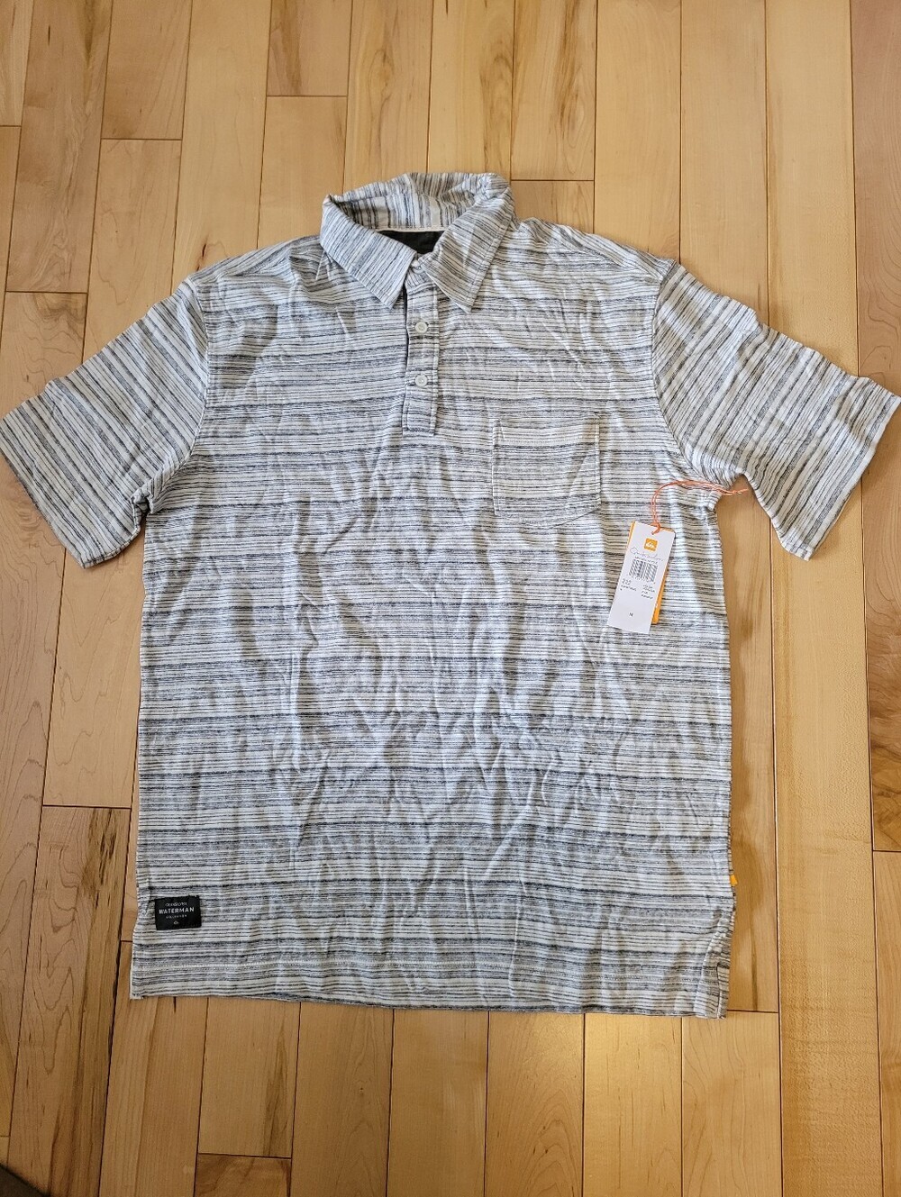 Brand new Quiksilver men's size medium polo shirt